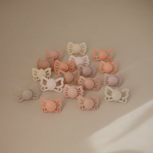 
                  
                    FRIGG Lucky Symmetrical Silicone Baby Pacifier | 2-Pack | 0-6 Months (Blush/Cedar)
                  
                