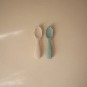 
                  
                    Silicone Toddler Starter Spoons 2-Pack (Cambridge Blue/Shifting Sand)
                  
                